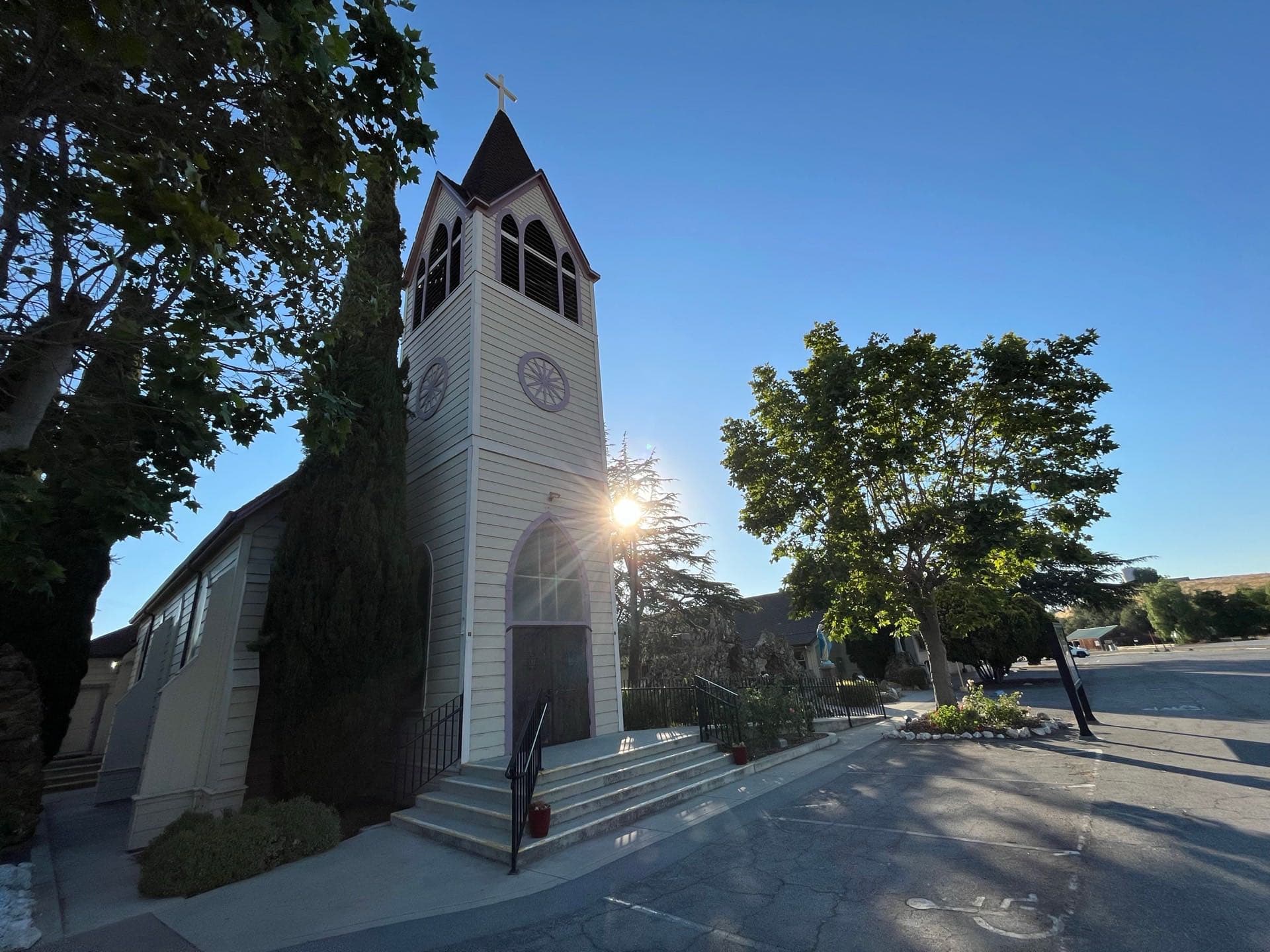 The historic white church of the Immaculate Conception in Tres Pinos at golden hour